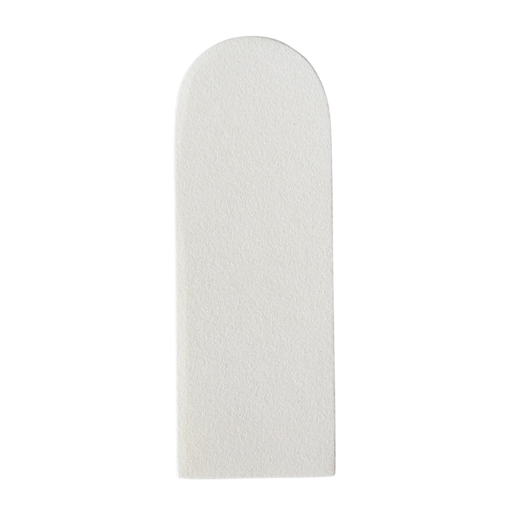 A white foot file pad that is attachable to a steel footfile.