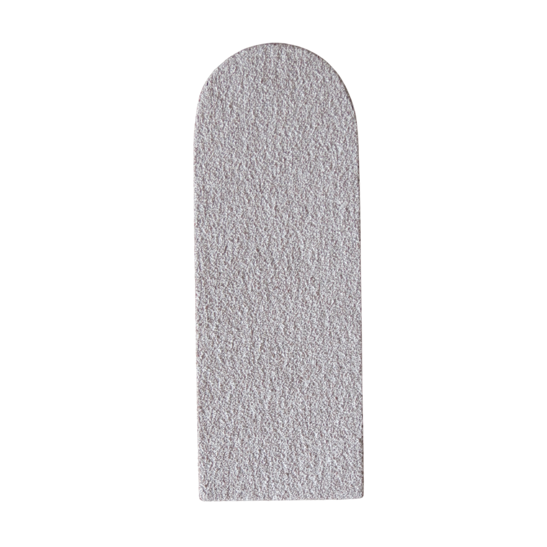 A textured, light gray arched rectangular pad or insert on a solid white background.