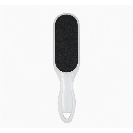 A handheld foot file or scrubber with a white plastic handle and a black textured abrasive pad, shown against a plain white background.